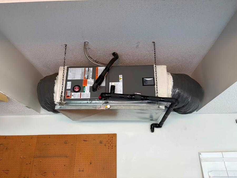 Horizontal air handler hung in a garage ceiling